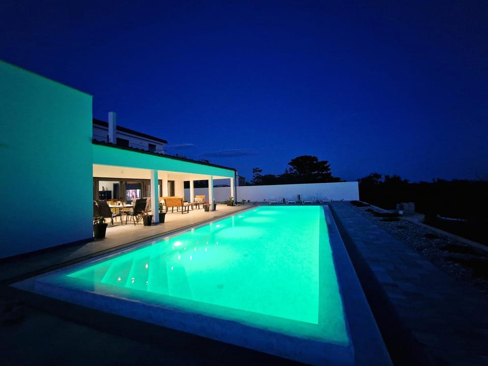 Property building, Night, Pool view, Swimming pool, sunbed