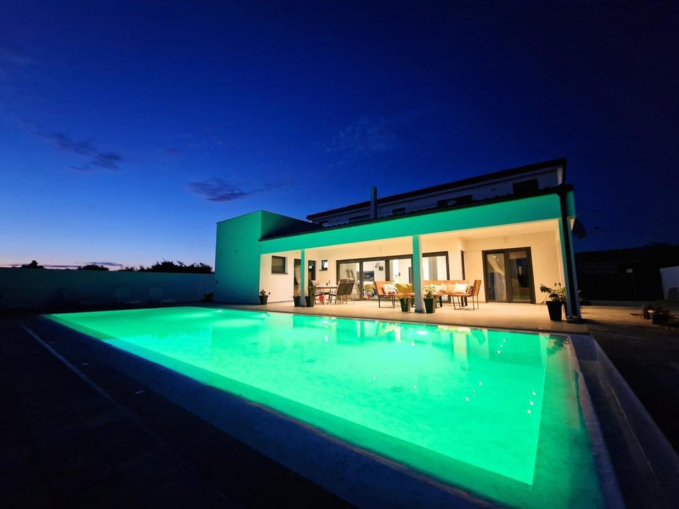 Night, Pool view, Swimming pool, sunbed