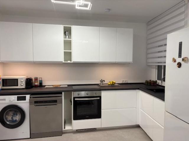Kitchen or kitchenette, dishwasher, oven, stove, toaster, washing machine, dryer