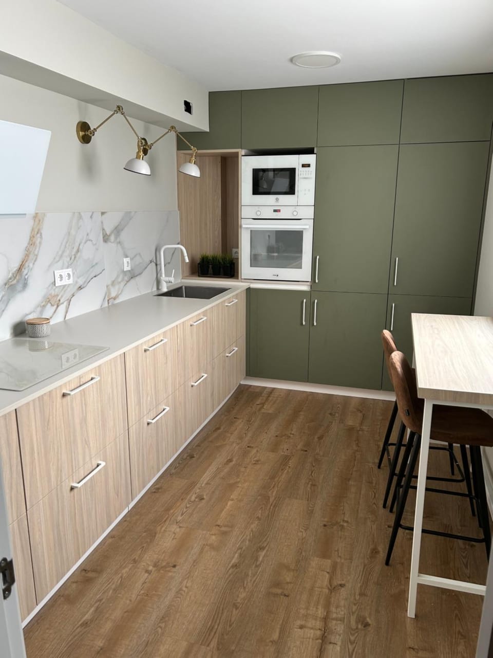 Kitchen or kitchenette, dishwasher, oven, stove