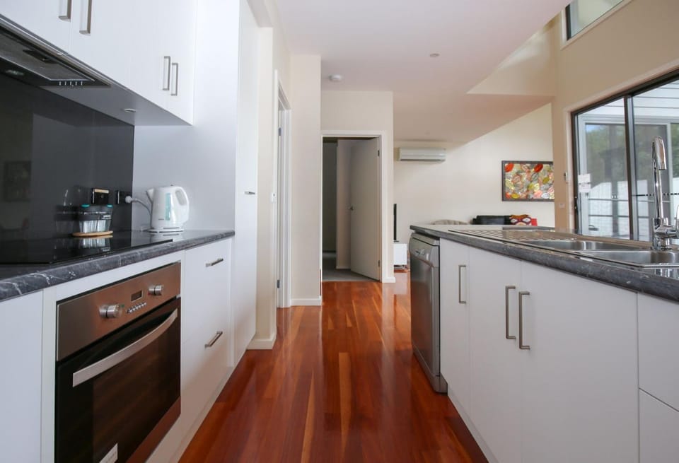 Kitchen or kitchenette, dishwasher, heating, oven, stove, air conditioner