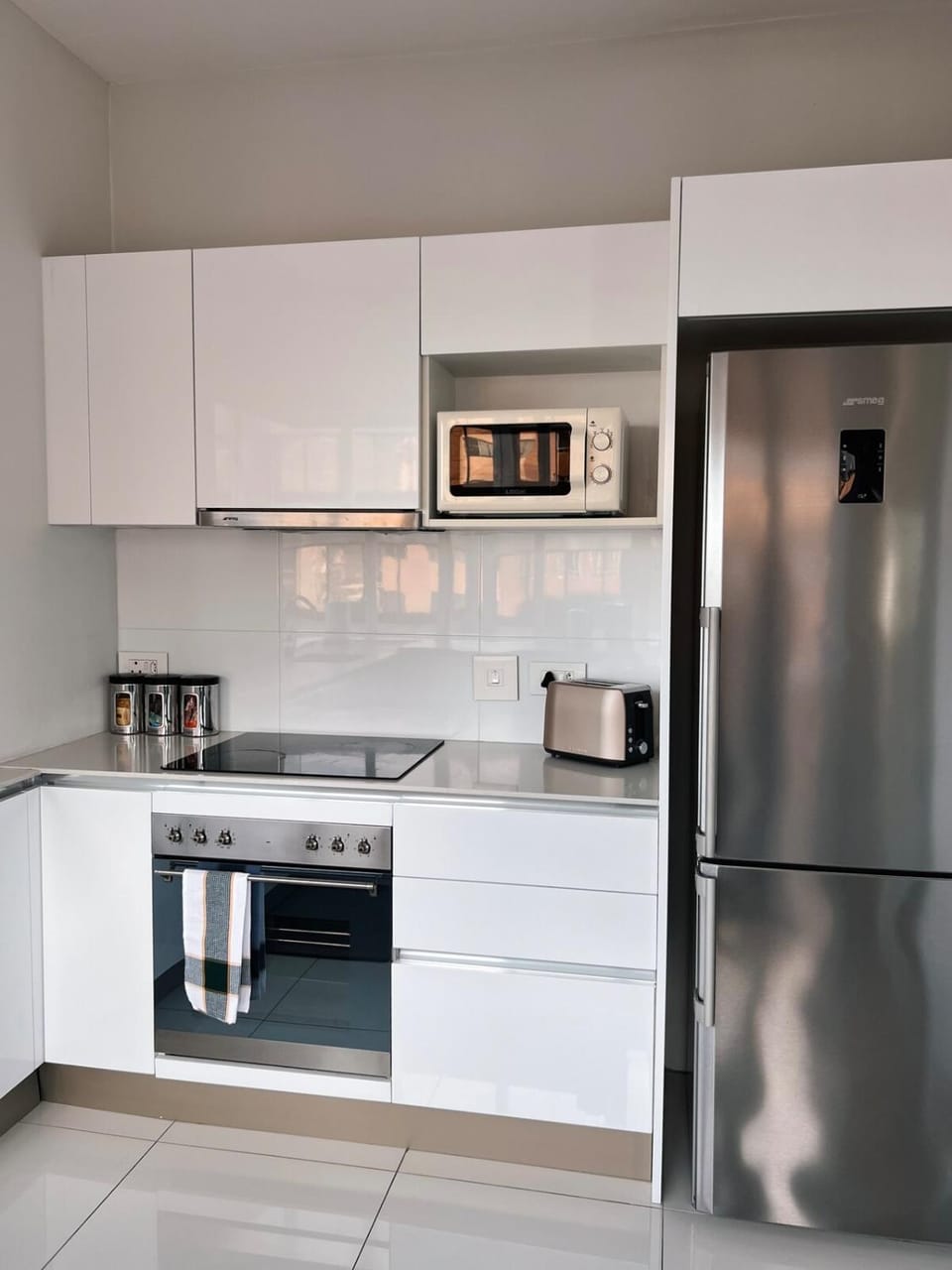 Kitchen or kitchenette, dishwasher, oven, stove, toaster