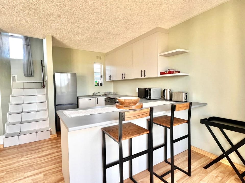 Kitchen or kitchenette, dishwasher, oven, stove, toaster