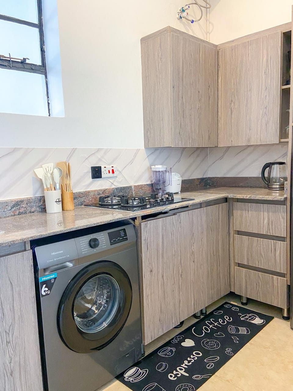 Kitchen or kitchenette, stove, washing machine
