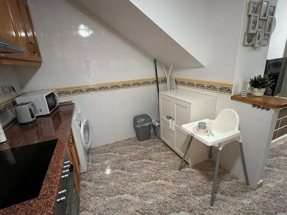 Kitchen or kitchenette, oven, stove, toaster