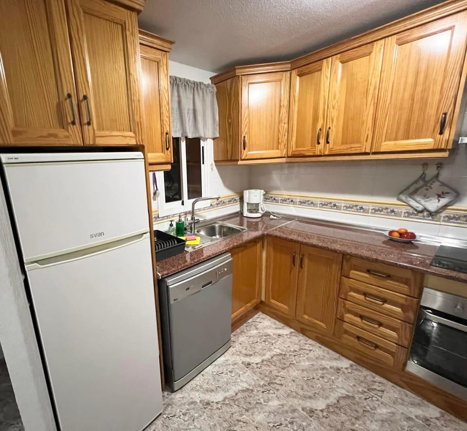 Kitchen or kitchenette, dishwasher, oven, stove