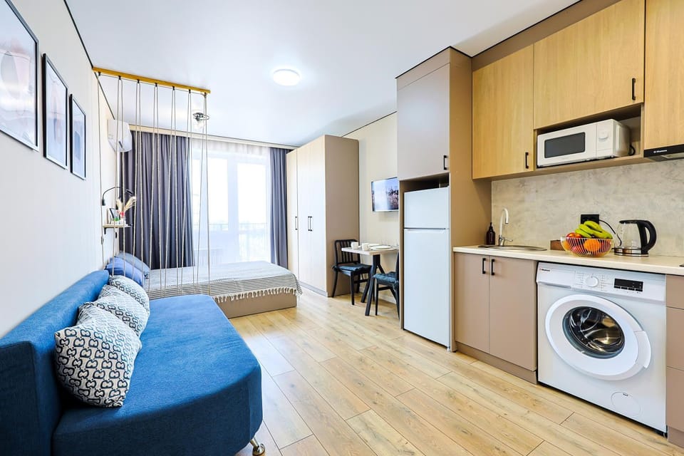 Kitchen or kitchenette, Seating area, Dining area, stove, washing machine, dryer