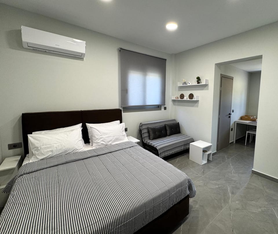 Bed, Living room, Seating area, Bedroom