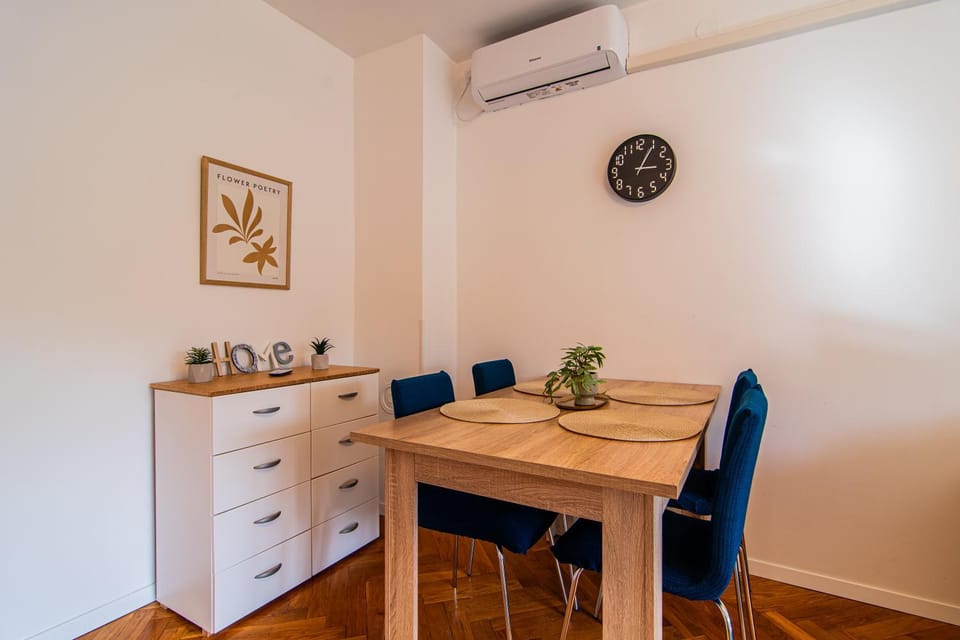 Seating area, Dining area, Text overlay, air conditioner