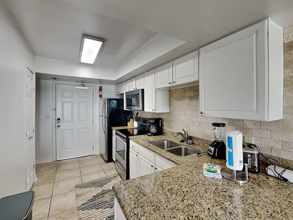 Kitchen or kitchenette, microwave, oven, stove, toaster, kitchen