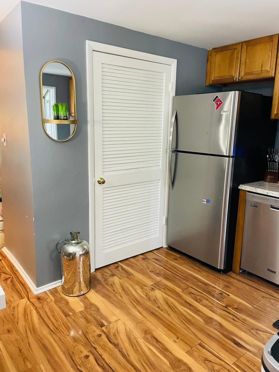 Kitchen or kitchenette, dishwasher, oven, stove, laundry