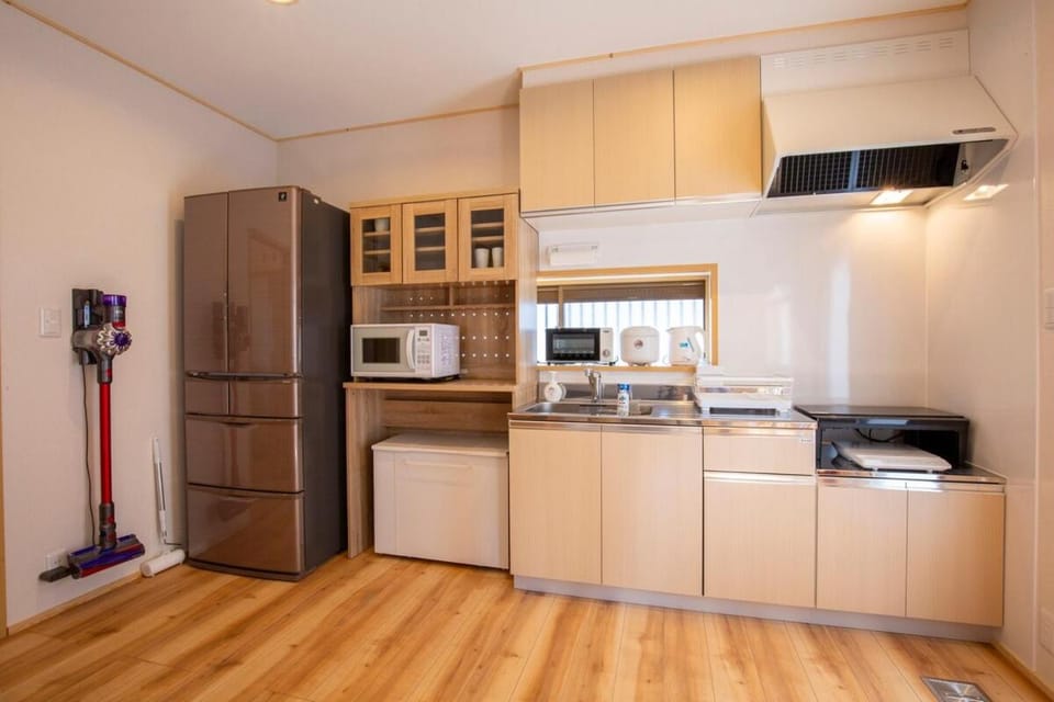Kitchen or kitchenette, microwave, stove, toaster