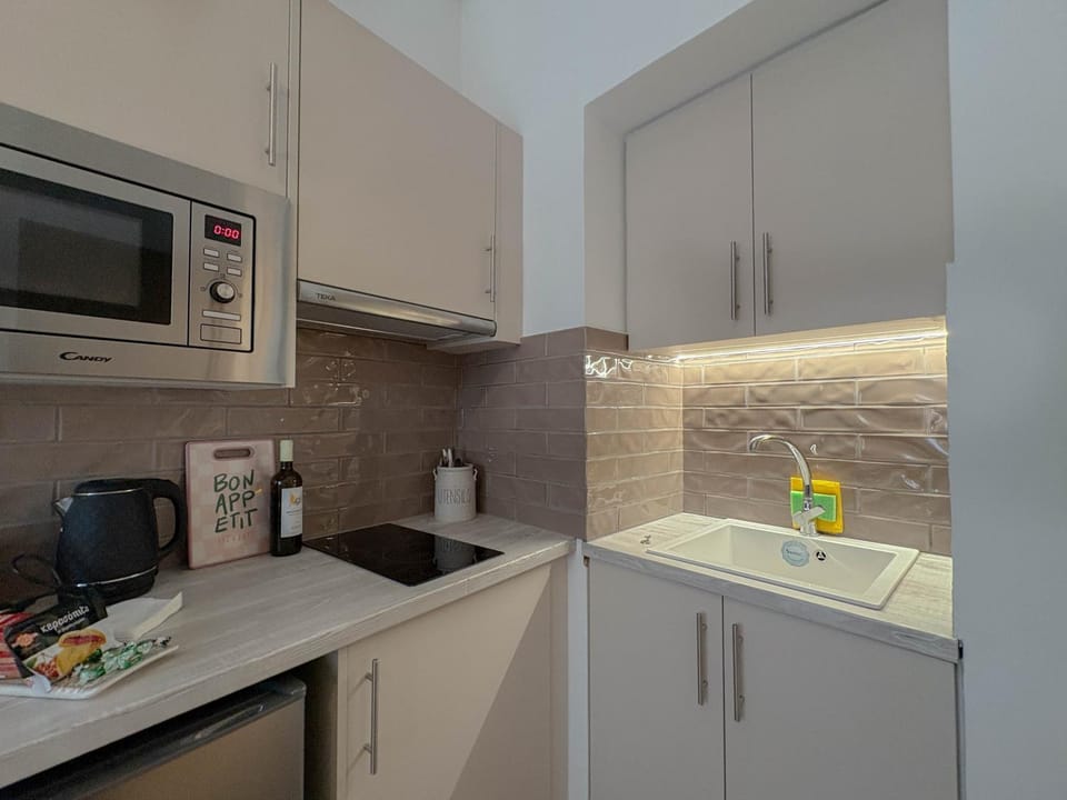 Kitchen or kitchenette, stove, toaster