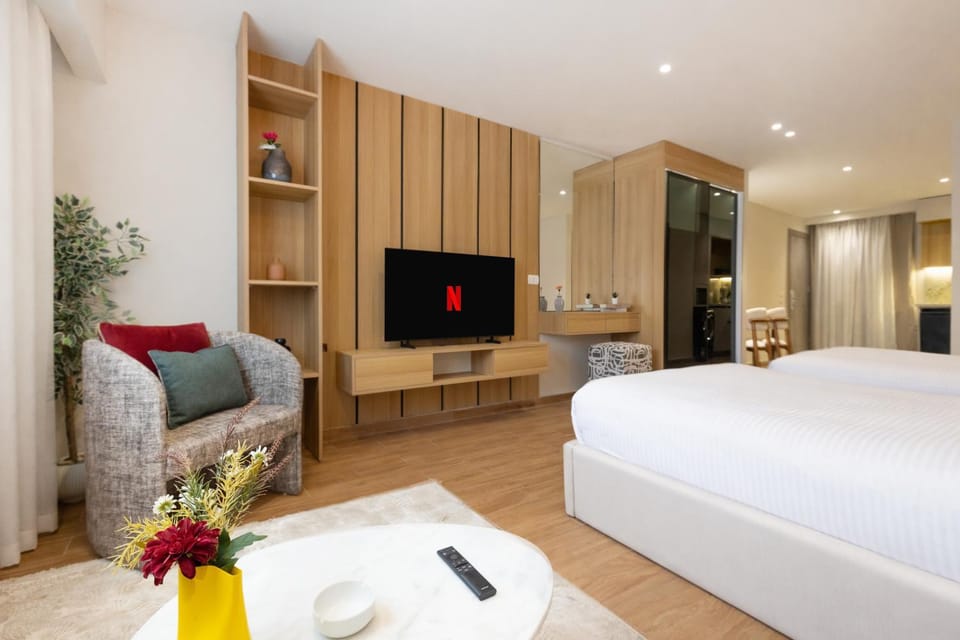 Bed, TV and multimedia, Living room, Seating area, Bedroom, wardrobe