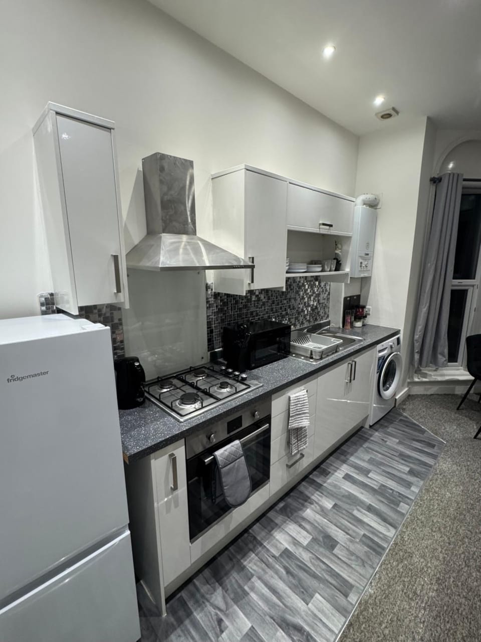 Kitchen or kitchenette, oven, toaster