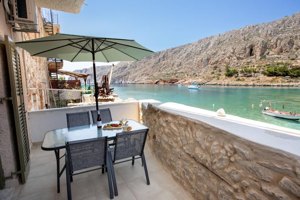 Property building, Patio, Nearby landmark, Day, Natural landscape, View (from property/room), Balcony/Terrace, Dining area, Beach, Mountain view, Sea view