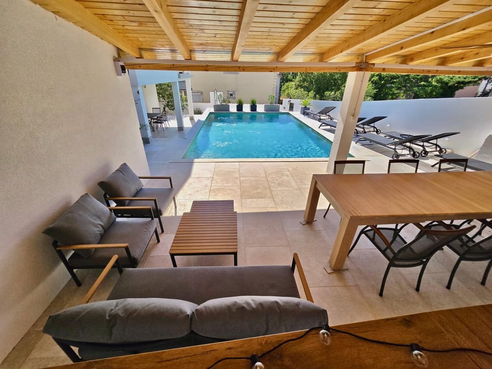 Patio, Day, Balcony/Terrace, Seating area, Dining area, Pool view, Swimming pool, sunbed