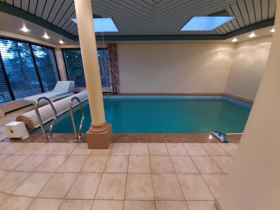Property building, Living room, Swimming pool