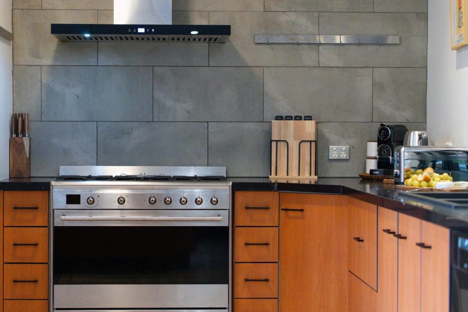 Kitchen or kitchenette, dishwasher, oven, stove