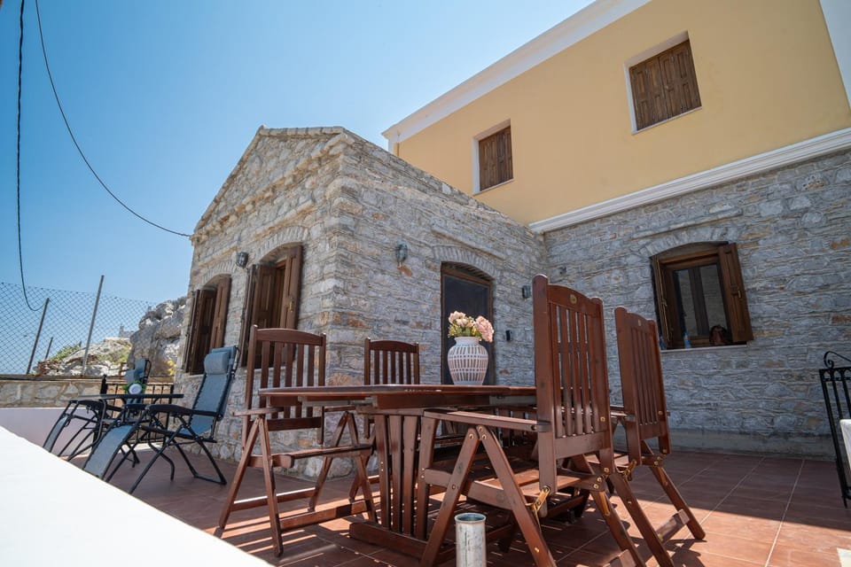 Property building, Patio, Day, People, View (from property/room), Balcony/Terrace, Balcony/Terrace, Living room, Seating area, Dining area, group of guests
