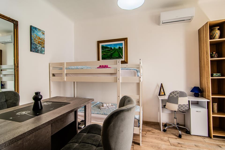Bed, Living room, Seating area, Bedroom, bunk bed, air conditioner