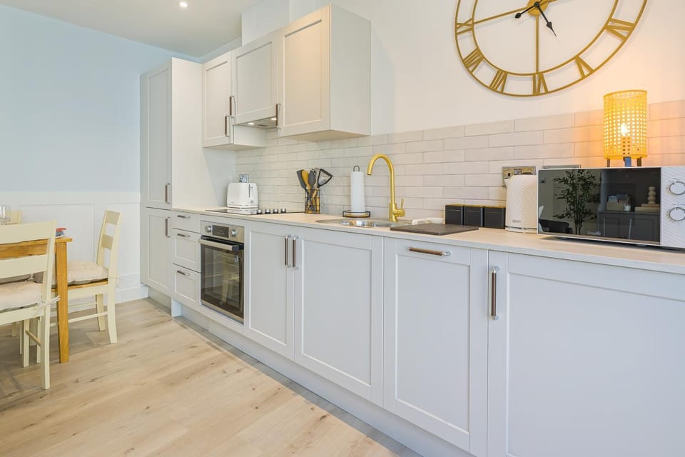 Kitchen or kitchenette, oven, stove, toaster
