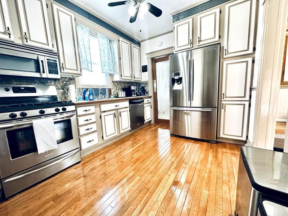 Kitchen or kitchenette, dishwasher, oven, stove, toaster