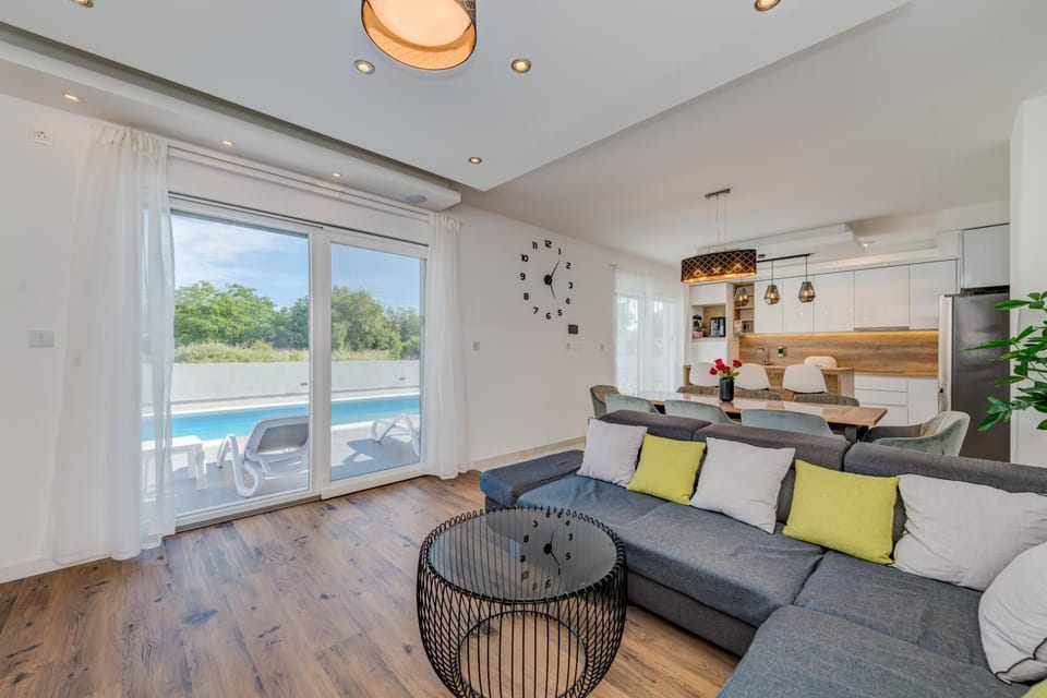 Living room, Seating area, Pool view
