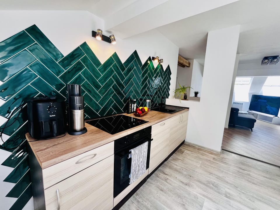 Kitchen or kitchenette, dishwasher, oven, stove