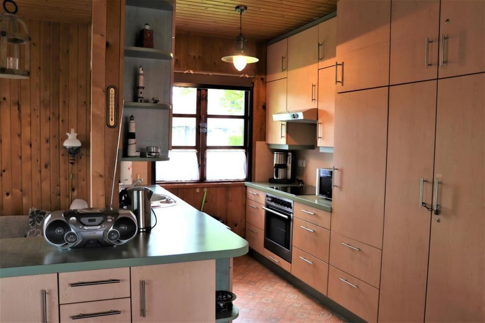 Kitchen or kitchenette, dishwasher, oven, stove