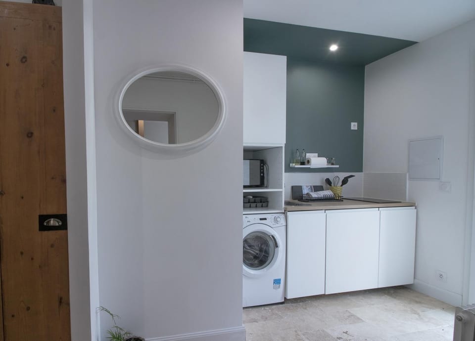 Kitchen or kitchenette, dishwasher, microwave, stove, washing machine
