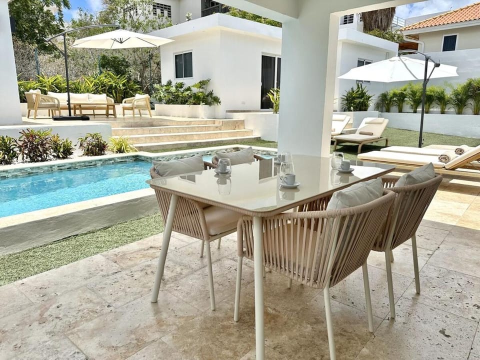 Property building, Patio, Day, Garden, View (from property/room), Seating area, Dining area, Garden view, Pool view, Swimming pool, Swimming pool, sunbed, towels