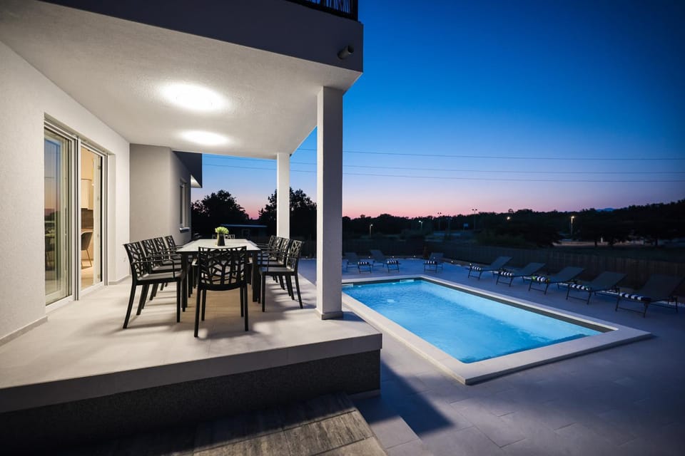 Property building, Patio, Natural landscape, View (from property/room), Balcony/Terrace, Pool view, Swimming pool, Sunset, sunbed