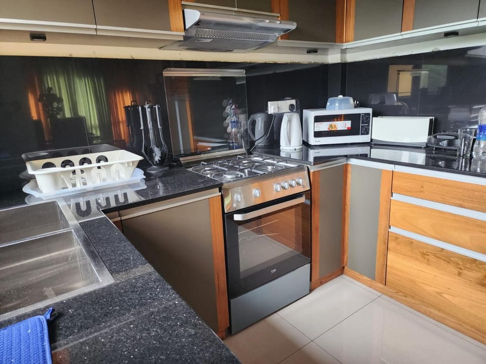 Kitchen or kitchenette, microwave, oven, stove, toaster