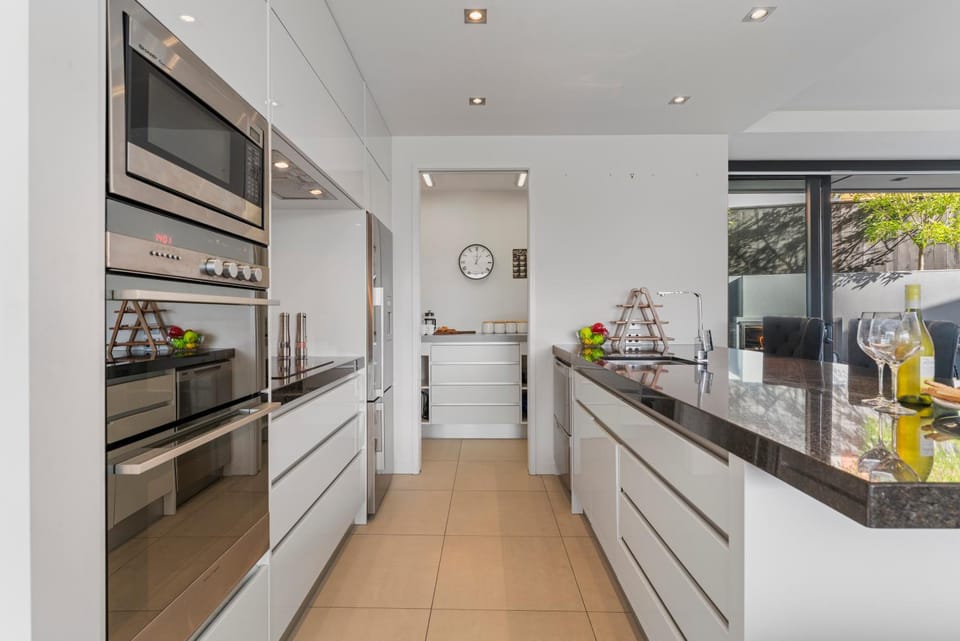 Kitchen or kitchenette, dishwasher, oven, stove