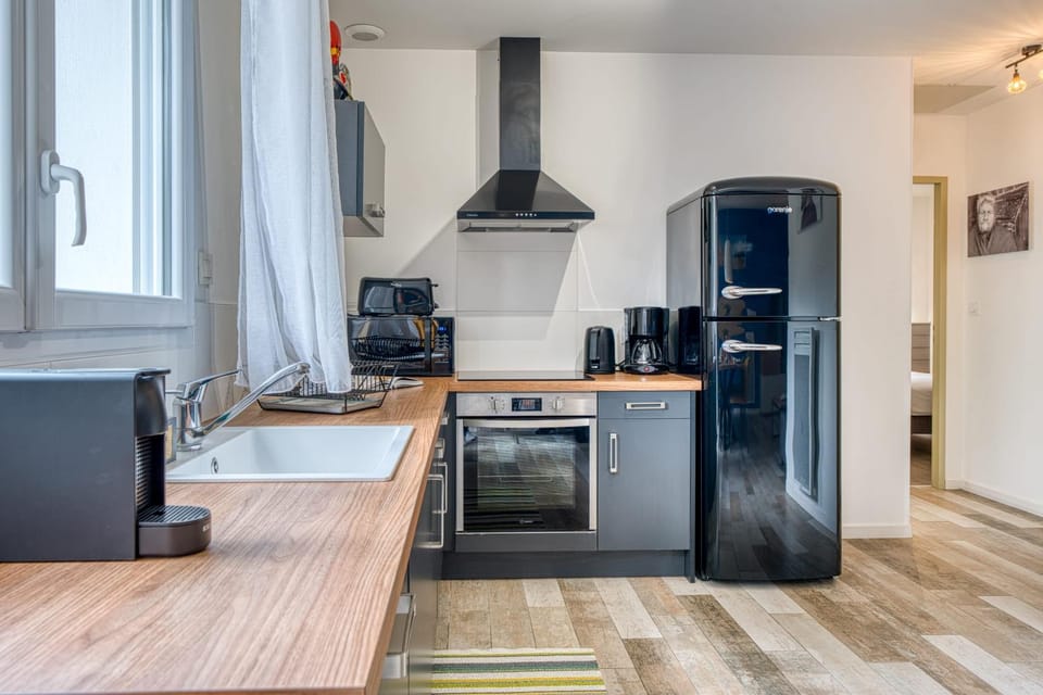 Kitchen or kitchenette, dishwasher, oven, stove