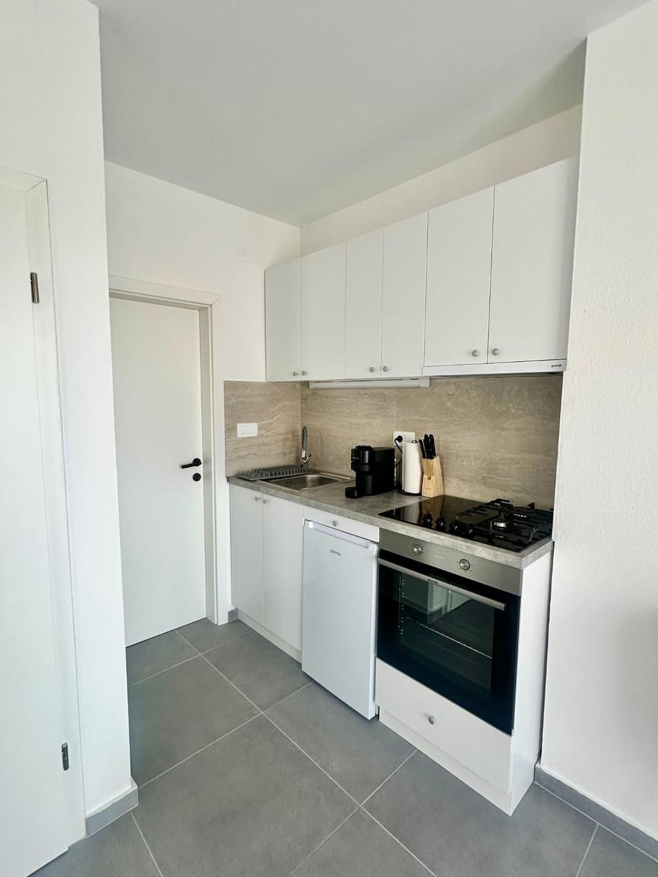 Kitchen or kitchenette, oven, stove, toaster
