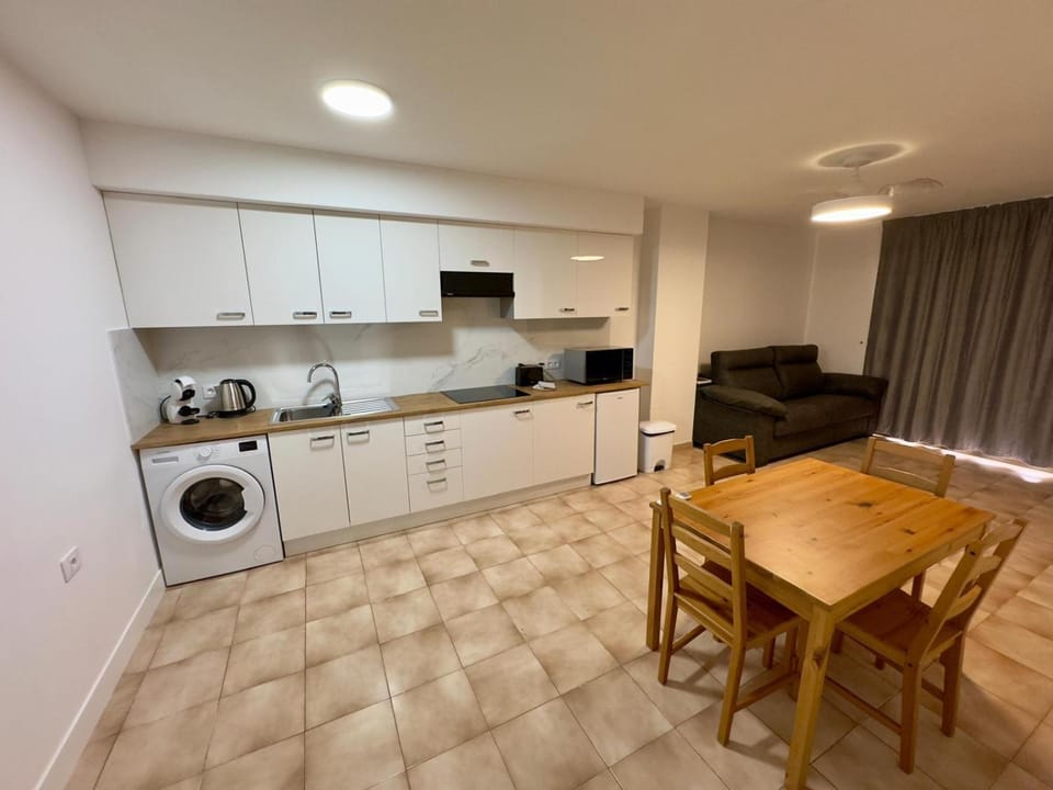 Kitchen or kitchenette, stove, washing machine