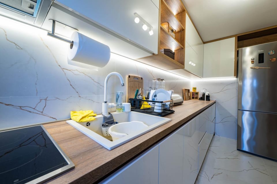 Kitchen or kitchenette, dishwasher, oven, stove, toaster