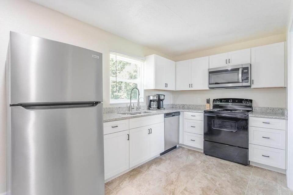 Kitchen or kitchenette, dishwasher, oven, stove