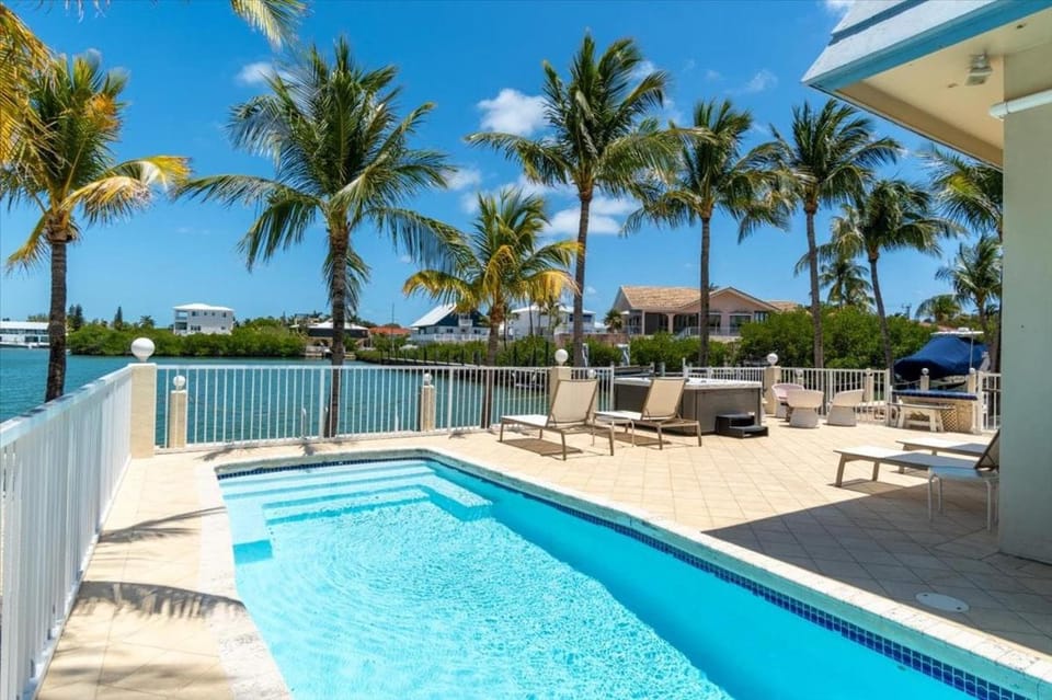 Blue Marlin House - Waterfront Pool Home, Steps from the Beach, Hot Tub, 210' Dock House in Marathon