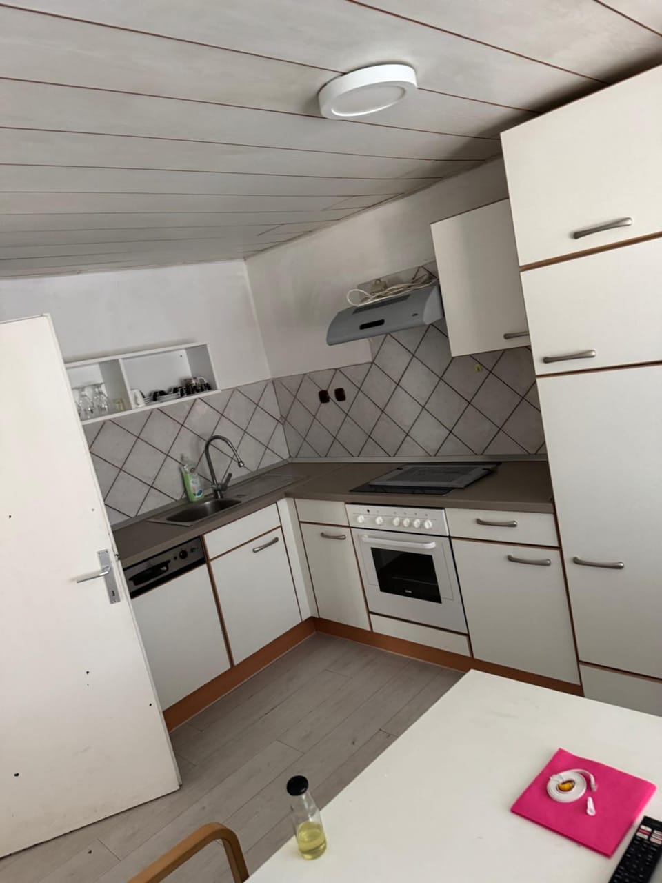 Kitchen or kitchenette, dishwasher, oven, stove