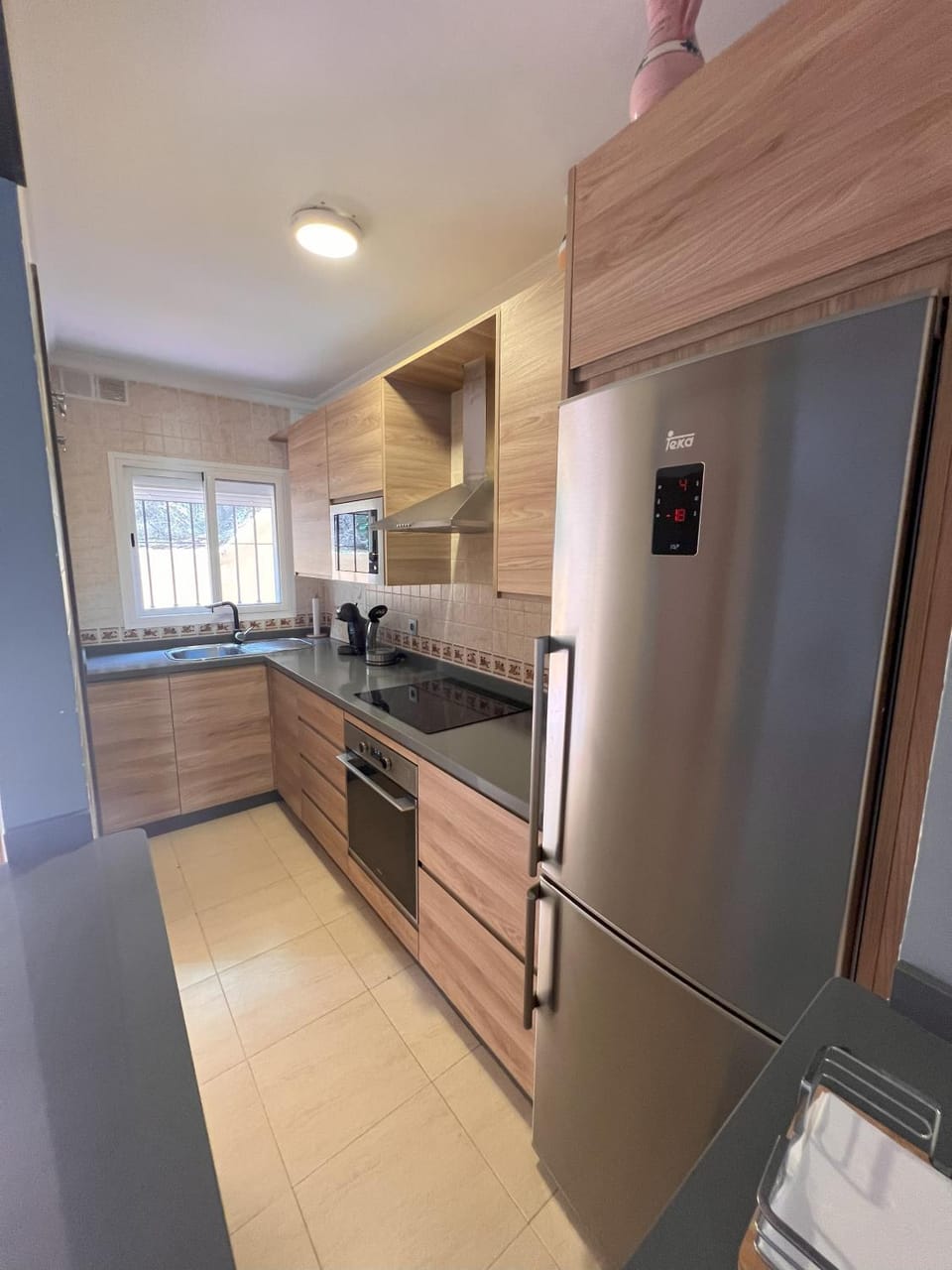 Kitchen or kitchenette, dishwasher, oven, stove