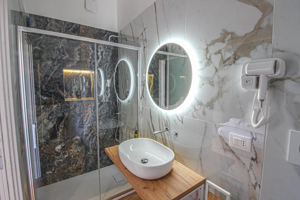 Shower, Toilet, Bathroom, hair dryier, towels