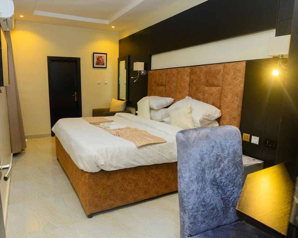 Bed, Living room, Seating area, Bedroom, towels, wardrobe