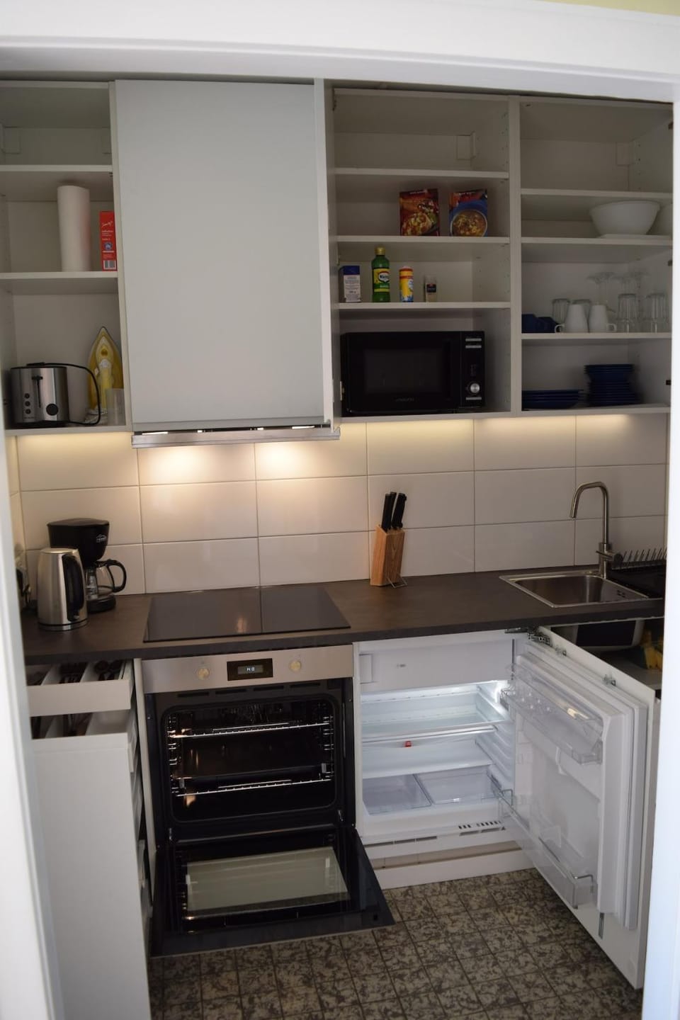 Kitchen or kitchenette, oven, stove, toaster