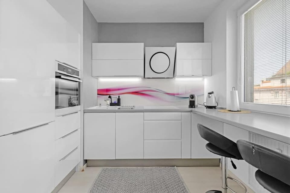 Kitchen or kitchenette, dishwasher, oven, stove