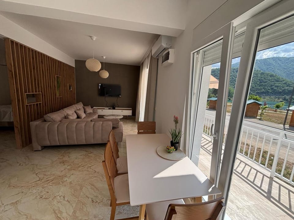 Natural landscape, View (from property/room), Living room, Seating area, Dining area