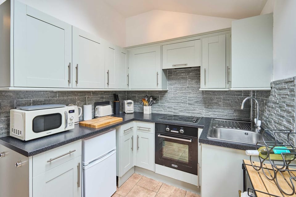 Kitchen or kitchenette, stove, toaster