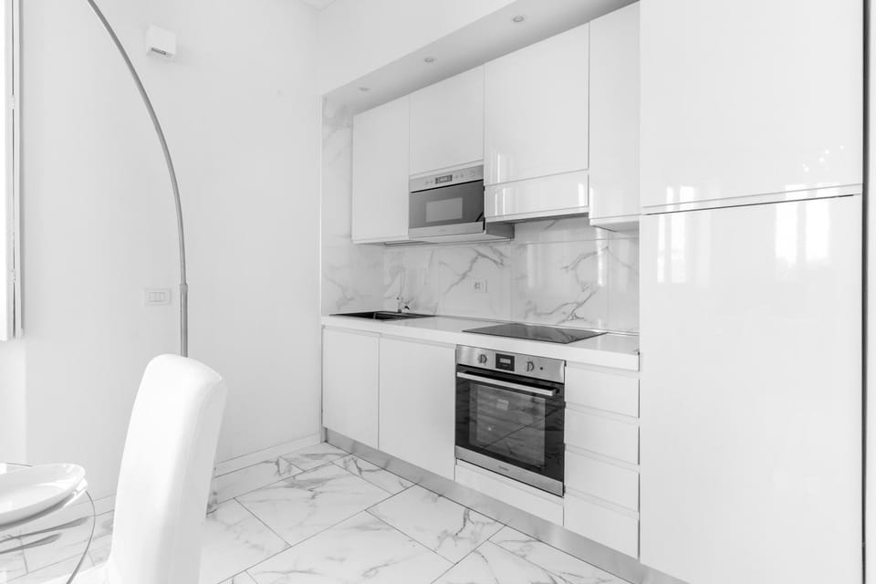 Kitchen or kitchenette, dishwasher, oven, stove
